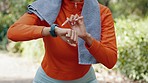 Woman sports runner with smartwatch for exercise, tracking running  time and heart beat after training workout for fitness. Healthy fit girl athlete with watch for timer to track performance progress