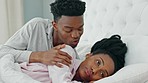 Relationship problems, upset and unhappy woman ignoring man after arguing, cheating or pms while lying in bed. Black couple feeling sad or depressed about marriage or relationship issues or trouble