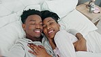 Selfie, kiss and happy influencer couple vlogging their honeymoon while lying in bed to love and relax together at home. Portrait of a loving black man and woman having romantic moment in the morning
