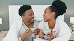 Happy, couple and coffee in bed of black people relax and calm with happiness in a house bedroom. Smile, love and calm home experience of a man and woman together with a blanket drinking tea