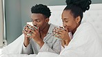 Love, couple and coffee in bed with a black woman and man in the bedroom to relax in their home. Young african american male and female drinking tea and relaxing in their house on the weekend