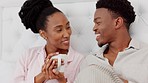 Happy, bed relax and love mindset of a black couple from Africa with morning coffee at home. Romantic partnership smile of man and woman talking, conversation and life discussion in a house bedroom 