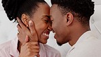 African couple with love, care in marriage and funny conversation in bed, talking in the morning and happy with communication in bedroom. Comic, smile and speaking man and woman relax in house