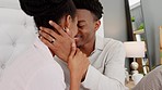 Marriage, happy and love couple relax in a bedroom apartment or at getaway hotel. Romance, care and romantic husband and wife or black people kissing on their honeymoon or valentines day anniversary