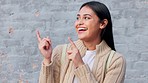 Happy, mock up and woman pointing to mockup space for sales advertising commercial or discount announcement. Smile, excited and young Indian girl portrait with marketing sales promo deal on grey wall