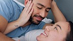Happy, relax and love couple in bed being romantic, talking and laughing in bedroom of house. Man and woman hugging, conversation and communication trust, support and quality time together at home