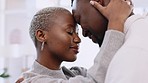 Black couple dancing at home together for love, relax and intimate fun day. African american people, smile dating partners and happy marriage with romantic dance, special moment and care relationship