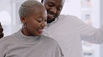 Carefree, black couple dancing to music and happy in their home after getting engaged, good news or promotion. Smile, romance and lovers or partners dance in the house in celebration of a good time.