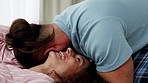 Couple in bedroom, happy woman and fun morning at home. Crazy happiness, people laughing together and young funny man in pyjamas. Comfortable joke, girlfriend hugging boyfriend and play smile