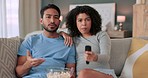 Arguing couple, tv remote and controlling woman changing the channel to watch a movie and eat popcorn on the sofa at home. Fighting, angry and upset man watching sports while girlfriend grabs control