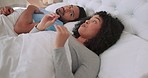 Frustrated, angry and argue couple in bed fight, disagreement and unhappy while talking, shouting or screaming in bedroom at home. Man and woman stress, divorce and upset about sex  or cheating