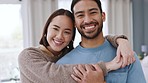 Love, happy couple and a smile in their home, house or bedroom. Romantic, interracial man and woman posing for an intimate photograph together smiling in happiness in their apartment in the morning

