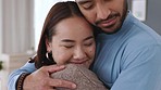 Couple giving love hug in home, happy in marriage and support in home together. Closeup face of happiness, missing and relaxing Asian man and woman hugging for safety and smile on romantic date