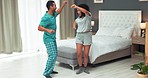 Dance freedom, bedroom couple and energy dancing, excited and moving to fun apartment, playful action and happy attitude at home. Young man, joy woman and music for love, funny and smile lifestyle