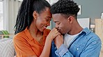 Love, trust and happy black couple being romantic and sharing a special bond with sweet man kissing hand of beautiful woman. Lovers sharing a laugh, care and spending free time together at home