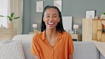Happy black woman, home in apartment living room and laugh at funny joke. Comedy show on couch, interior lounge and property real estate. Portrait of african girl, dental smile and relax on weekend