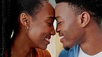 Love, couple and kiss with a couple kissing, bonding and loving in her home with romance and affection. Married black woman and happy man sharing an intimate and romantic moment in their house
