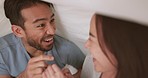 Happy, playing and couple games in a bedroom with man and woman laugh and having fun in bed. Young romance with asian husband and wife excited and playful, celebrating free time and relationship 