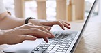 Woman hands, laptop and typing ebook from house living room, home interior or public office space. Zoom on author, freelance blogger entrepreneur or ghost writer for internet blog on table technology