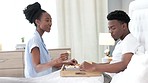Black couple, breakfast in bed and love bond while in bedroom and eating in house, home or hotel. Woman serving man health food and juice drink in celebration of birthday, honeymoon or anniversary