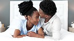 Love, kiss and couple hug in bedroom after intimate and private discussion together at home. Black people in romantic relationship that respect, care and trust each other with personal secret.