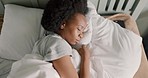Bedroom, insomnia and girl with sleep problem or mental health difficulty trying to rest in home. Frustrated, moody and unhappy black woman with struggle to relax in comfortable position on pillow.