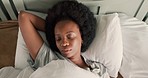 Tired black woman wake up in bed on summer morning with bright sun sleeping in home bedroom or house. African girl or afro person exhausted, insomnia and deep breathe for sleepless night at apartment