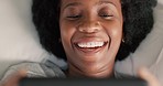 Black woman in bed with phone, laugh on video call or  streaming comedy. Technology, internet and social media in the morning, happy lady lazy in bedroom and surfing the internet for funny videos.