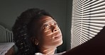 Black woman open window blinds in home, house or apartment for sunlight in morning on summer day. African girl, young person or student wake up from bed in college or university bedroom for sunshine