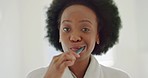 Black woman afro, dancing and brushing teeth in the bathroom in joyful morning happiness at home. African female smile and happy sing and dance in care for mouth hygiene with tooth brush in joy