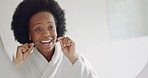 Mirror, dental floss and teeth healthcare black woman cleaning mouth for healthy gums, smile and fresh breath. African person, bathroom with toothbrush, toothpaste and flossing morning shower routine