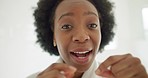 Black woman use dental floss, care for teeth wellness in the morning and smile while home. Happy African lady cleaning mouth with oral product for hygiene, beauty and healthcare in bathroom mirror