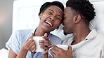 Relax, flirt and a couple with coffee in bed on a weekend morning. Love, romance and a black woman and man happy in the bedroom with a hot drink. lovers, friends and partners, a healthy relationship.
