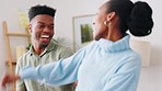 Happy young couple dancing in home to hip hop music for morning body wellness or real estate celebration. Happiness, love and gen z black people dance in together in living room apartment