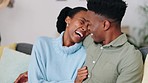Love, laugh and african couple relaxing on a sofa in their modern home while having a conversation. Happy, young and black man and woman having fun and embracing each other while resting together.