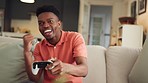 Gaming, winner and happy gamer on a video game playing arcade competition on tv and winning it. Smile, victory and young black man has an addiction to fun electronic games experience to relax at home