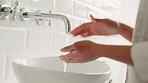 Woman cleaning hands with soap, water and care for wellness, healthy lifestyle and safety from corona virus bacteria. Zoom on skincare, hygiene and bathroom grooming at home for covid risk protection