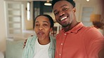 Young couple in new home on video call with family and friends. Black couple speaking on smartphone in living room, smiling, excited and celebrating home. Portrait of people in relationship 