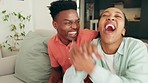 Black couple, video game and excited gaming in living room for fun, relax and happy together. Young, laughing and celebrate people playing esport console control, winning challenge and entertainment