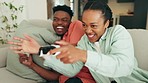Happy gaming couple on video game console in the living room or home sofa for win, challenge and esport lifestyle. Excited gen z black people or gamer friends with online action and fun competition