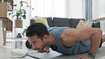Man doing workout for fitness training, motivation for healthy body and exercise for wellness in living room in house. Strong, power and Asian athlete doing pushups for cardio, muscle and performance