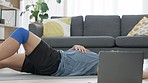 Man tired from fitness training with online workout video on laptop, breathing fast after cardio exercise for healthy body and reading instruction for sports on the internet. Asian man doing crunches