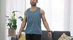 Jump rope, fitness and home exercise of a man working out in at home in a living room. Health, workout and sports training of a healthy athlete doing cardio at a house or apartment with fast energy