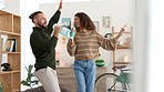 Singing couple, dance or cleaning house living room with spray bottle, housekeeping product or home cleaner. Happy smile, fun man or comic woman in spring clean bond for interior hygiene maintenance
