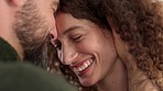 Love, happy couple and commitment while touching face, laughing and bonding closeup at home. Smiling man and woman in a loving, healthy and close relationship while enjoying their marriage and bond