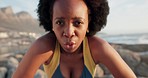 Tired, portrait and black woman doing exercise at the beach, breathing after running by the sea and fitness training by the ocean. Face of athlete runner with motivation for sports marathon in nature