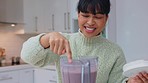 Woman with strawberry smoothie blender drink on kitchen counter finger taste for wellness detox or healthy diet. Nutritionist person with nutrition fruits cocktail or protein milkshake breakfast
