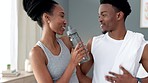Fitness, wellness and happy couple drinking water after a healthy exercise, training and workout together. Smile, black woman and African person love living a healthy, balanced and active lifestyle