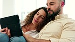 Video tablet streaming, couple and web movie watching of happy woman and man at home on a sofa. Love of people relax and calm in a house living room on a online internet stream website on a couch