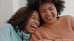 Conversation, black girl friends and laughing on sofa in living room talking, gossip and smile at funny comedy comic joke. African women, silly sisters or siblings speaking, chat or discussion on joy